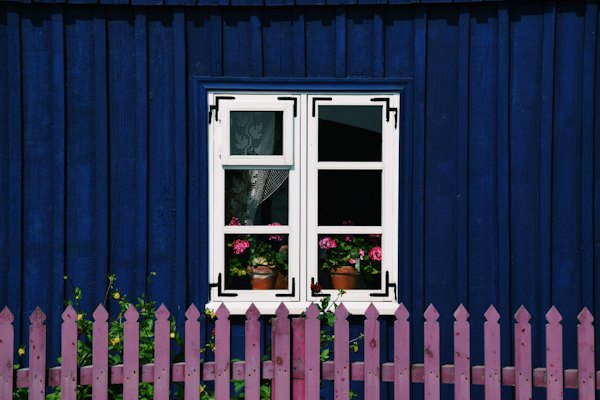A blue house with a pink picket fence — Klaipėda, Lithuania