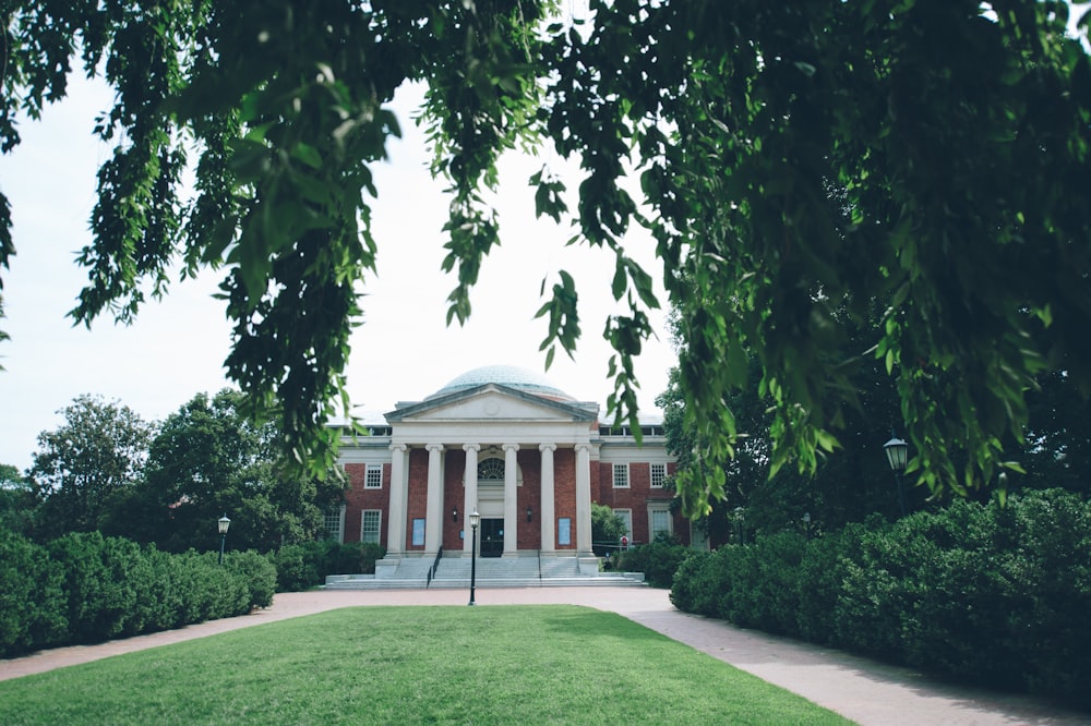 a large building with a large lawn in front of it