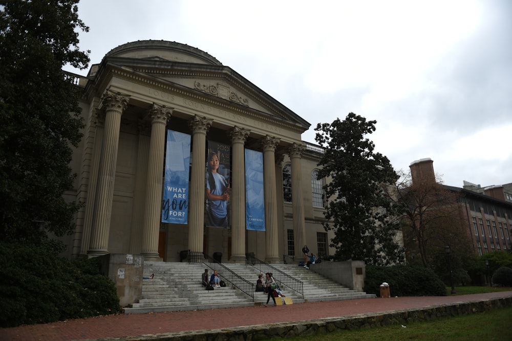 a large building with columns and steps leading up to it