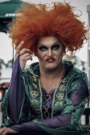 a man with red hair wearing a costume
