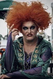 a man with red hair wearing a costume