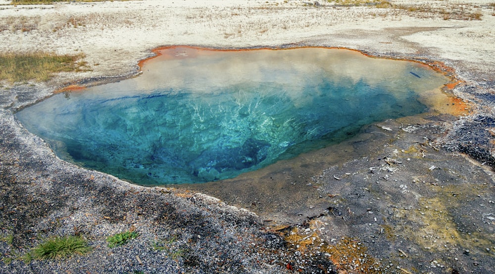 a large pool of water surrounded by rocks