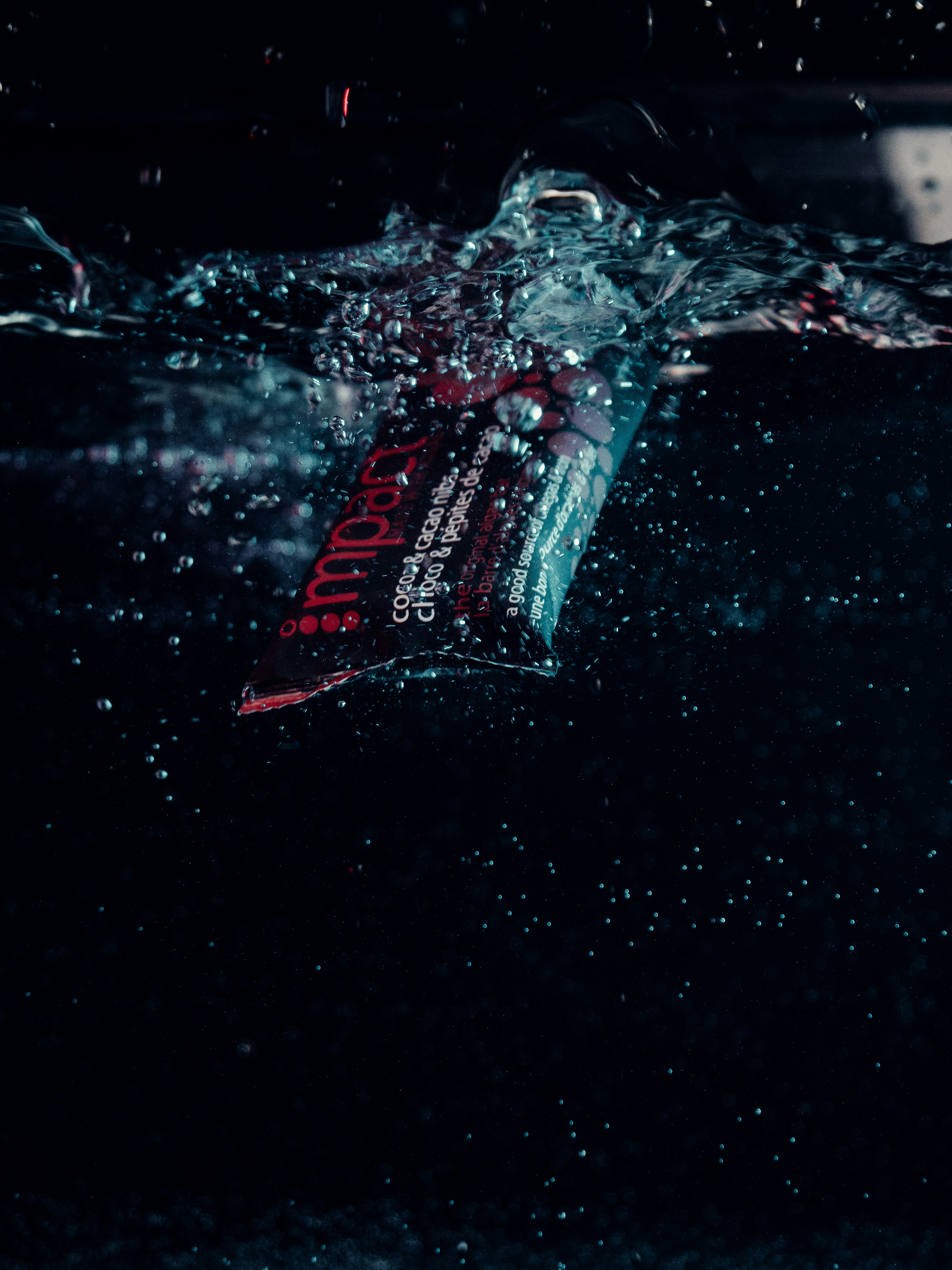 A tube of toothpaste floating in the water photo – Free Bar Image on ...