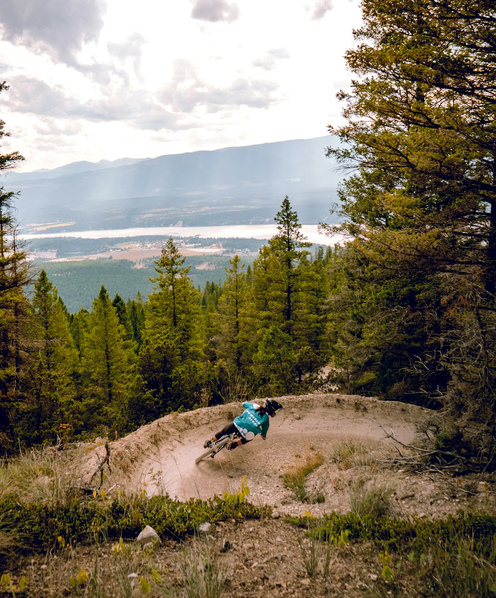 a person riding a mountain bike on a trail