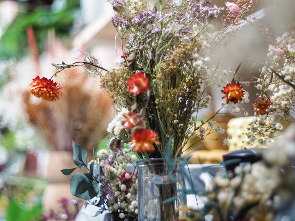 a vase filled with flowers sitting on top of a table