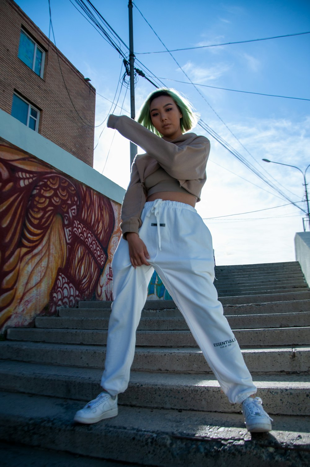 a woman standing on a set of stairs