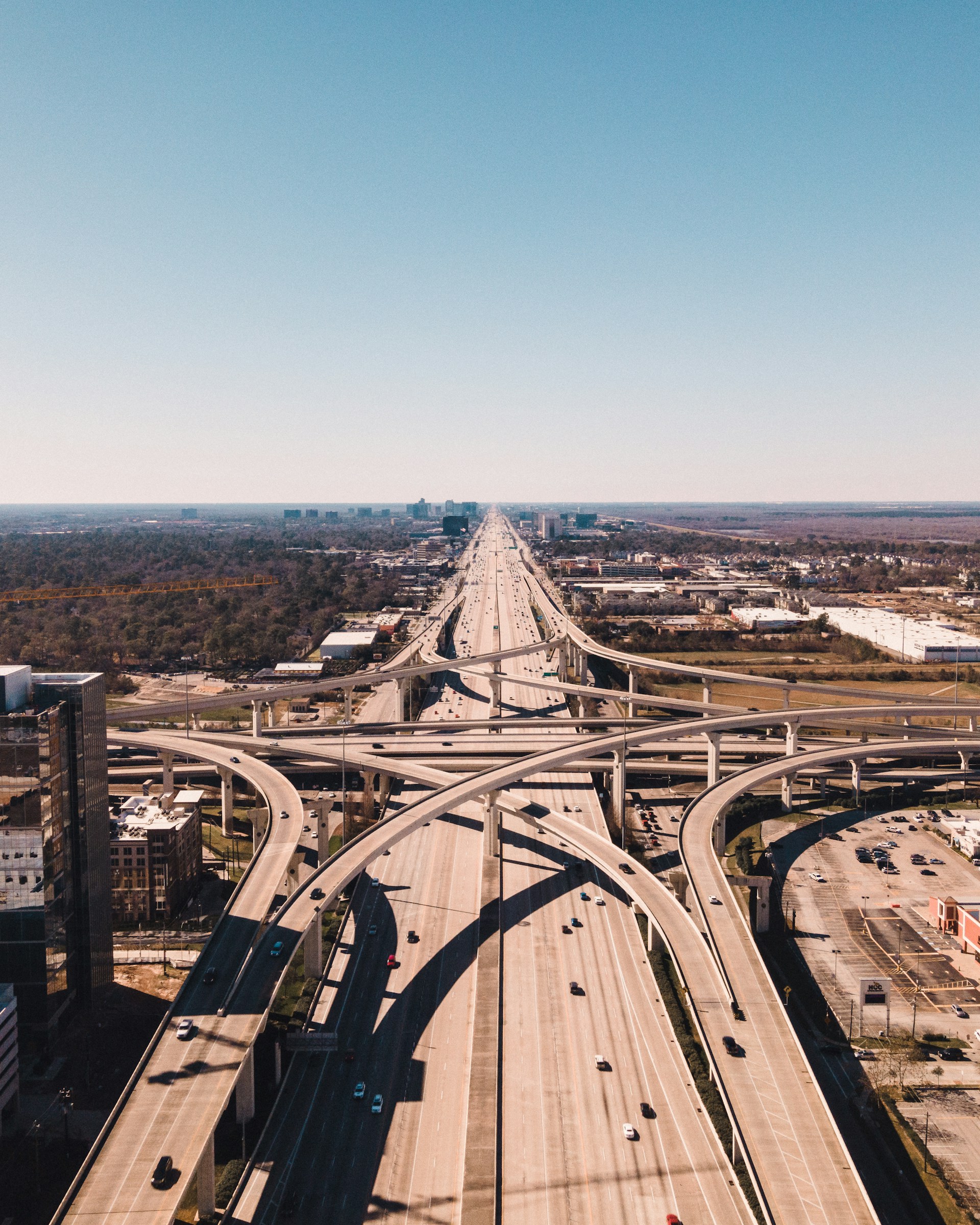 an aerial view of a highway intersection in a city