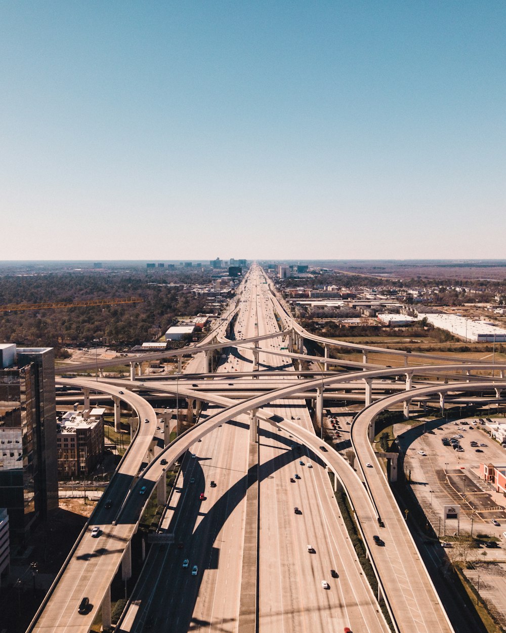 an aerial view of a highway intersection in a city