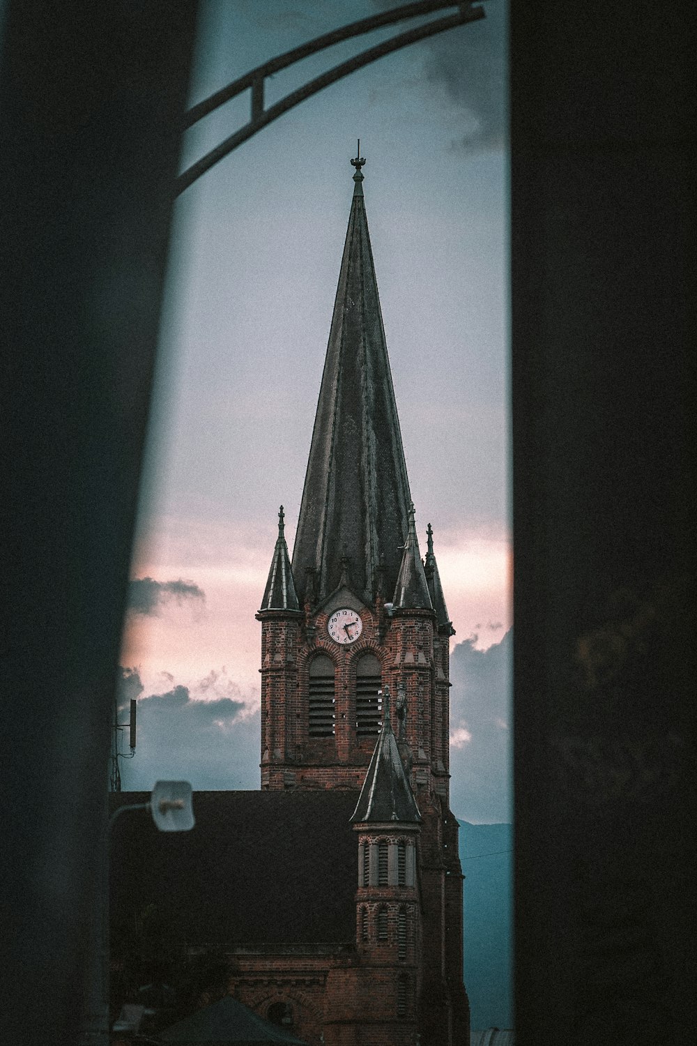 a view of a clock tower from a window