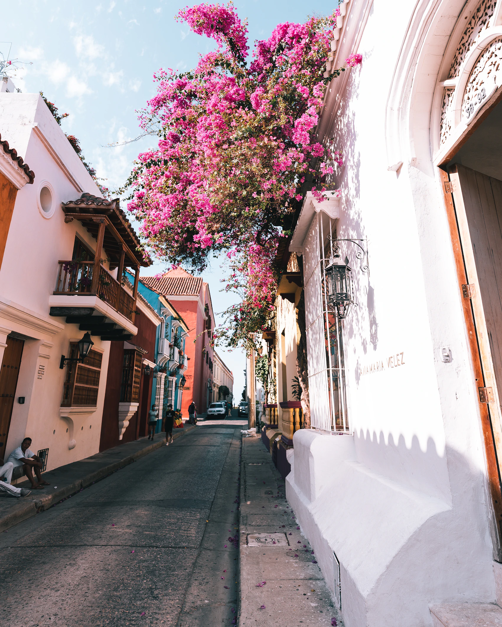 A colourful colonial street filled with flowers in Cartagena, Colombia