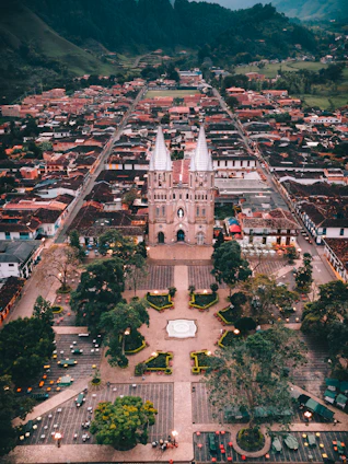 an aerial view of a city with a clock tower