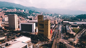 an aerial view of a city with tall buildings