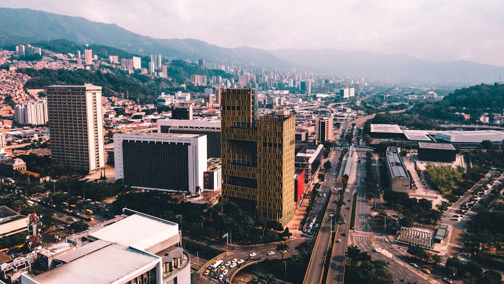 an aerial view of a city with tall buildings