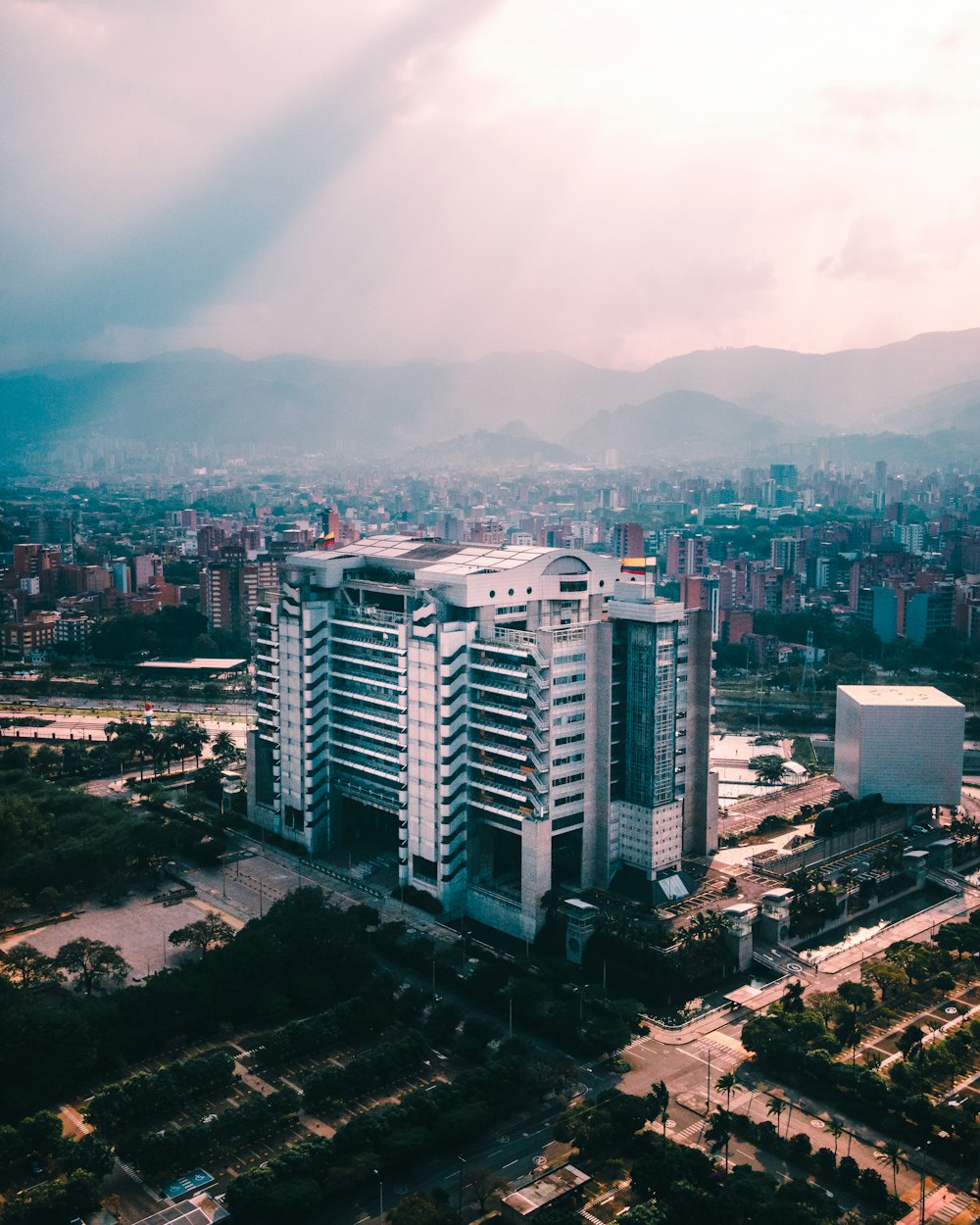 an aerial view of a city with tall buildings