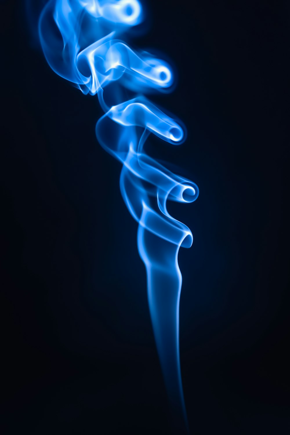 blue smoke on a black background