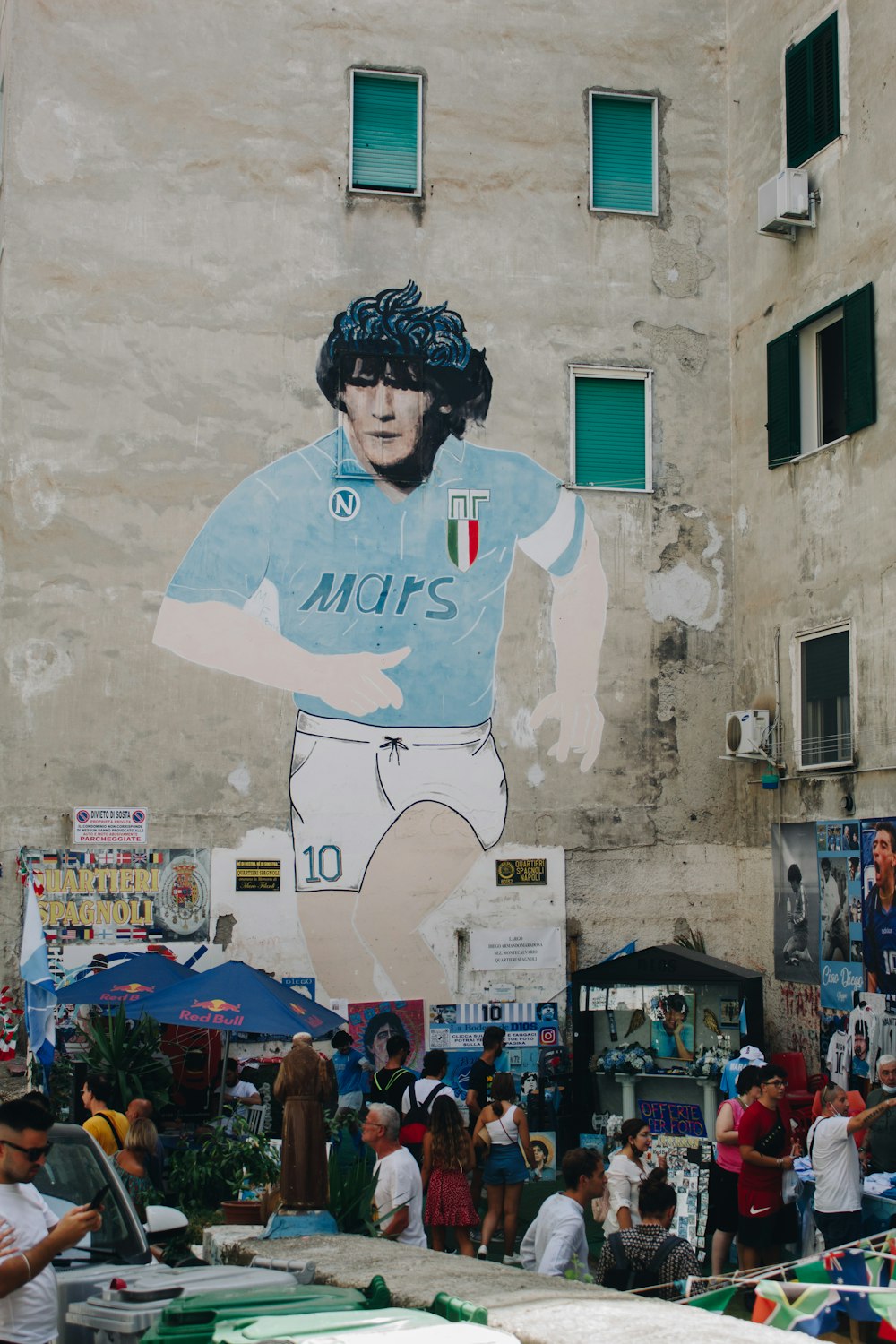 a large mural of a man in a blue shirt