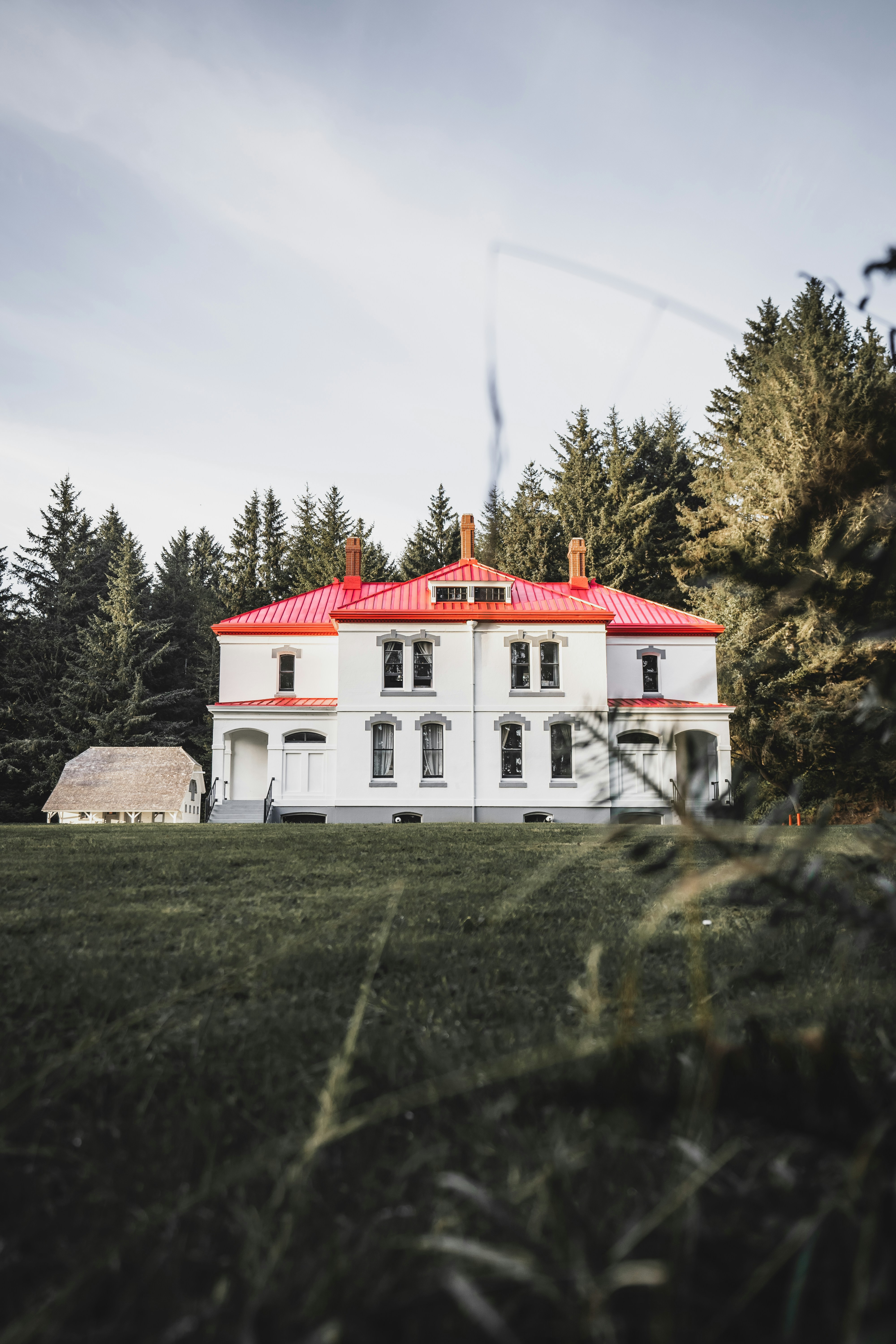 a large white house with a red roof