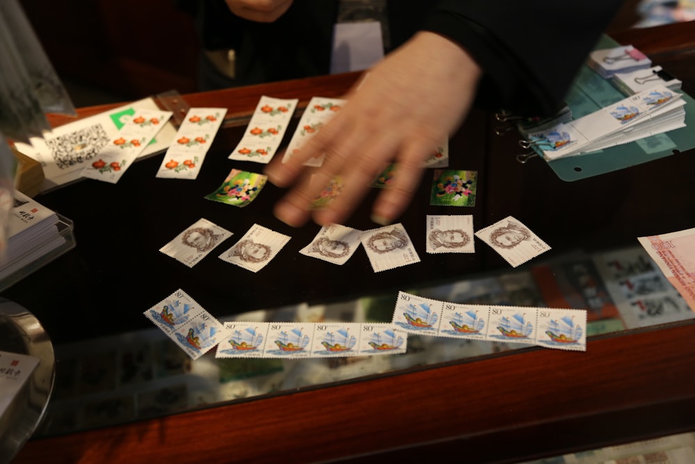 a person playing a game of cards on a table