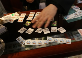 a person playing a game of cards on a table