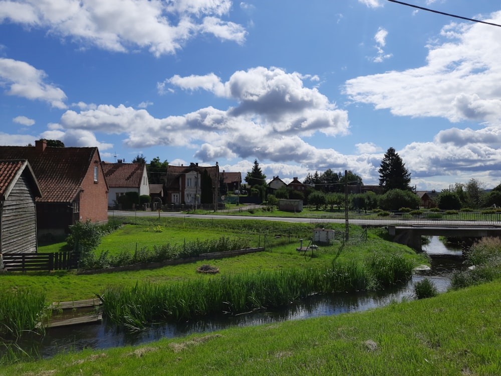 a river running through a lush green countryside