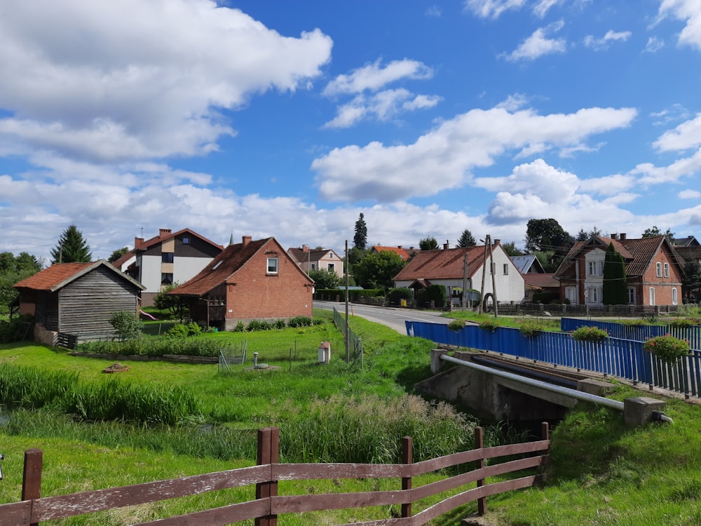 a rural area with houses and a bridge