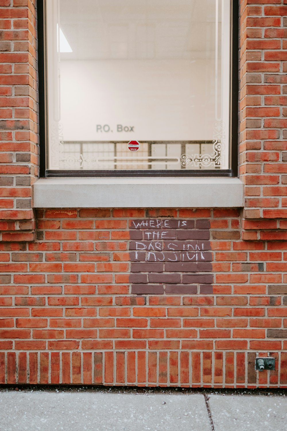 a brick building with a sign on the side of it