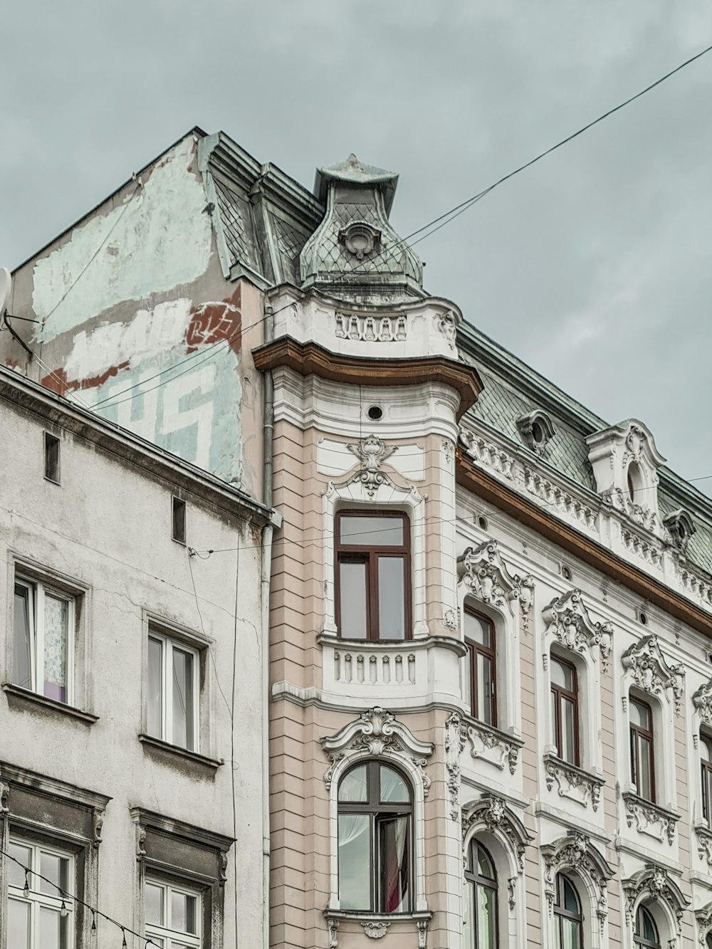 an old building with a clock on the top of it