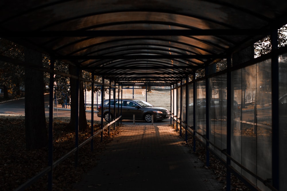 a car parked in a covered parking lot