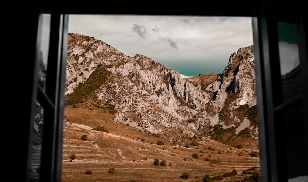 a view of a mountain from a window