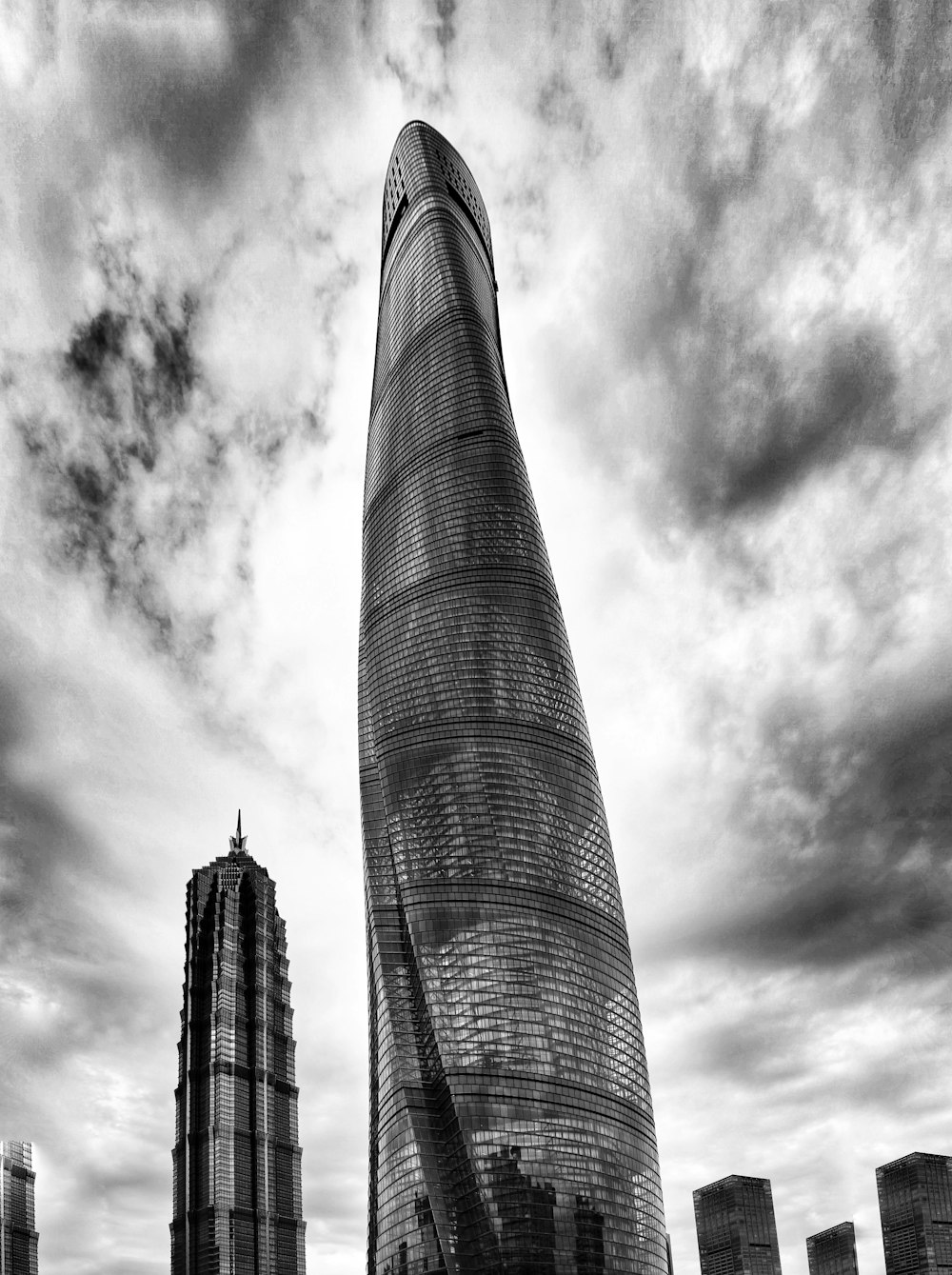 a black and white photo of a very tall building