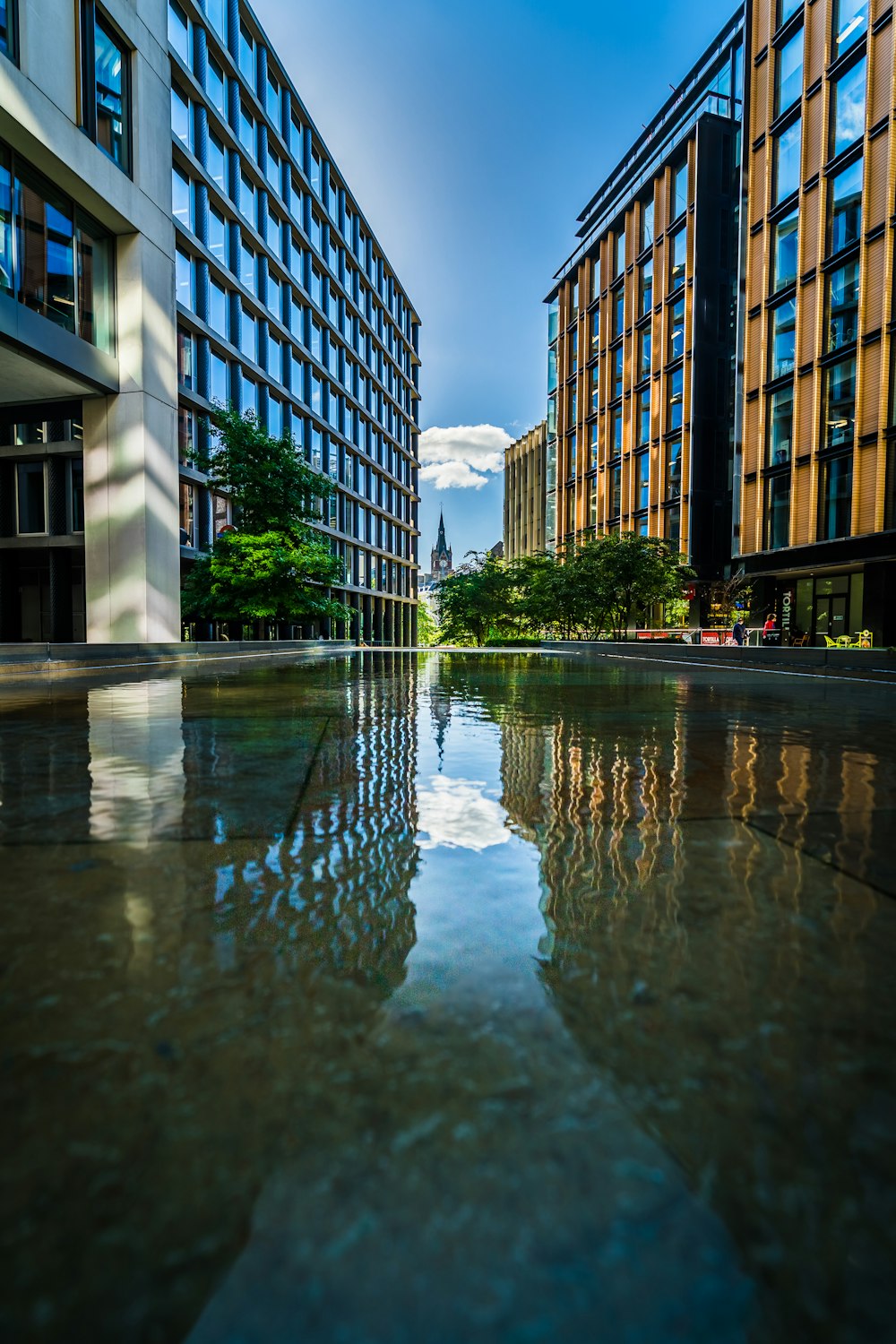 a pool of water in front of a large building