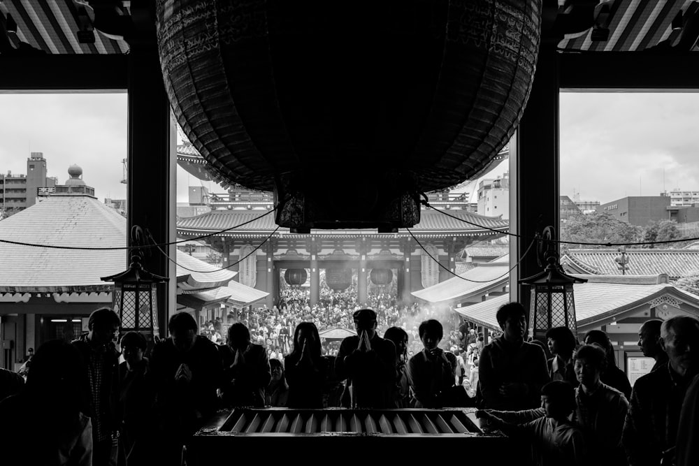 a black and white photo of a crowd of people