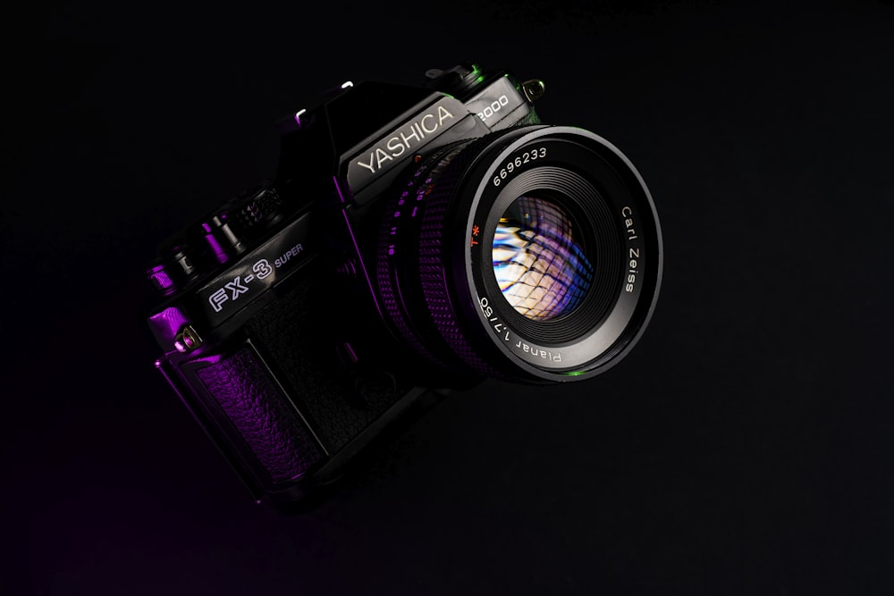 a close up of a camera on a black background