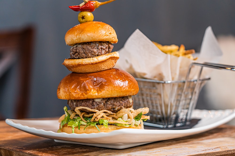 a hamburger sitting on top of a white plate