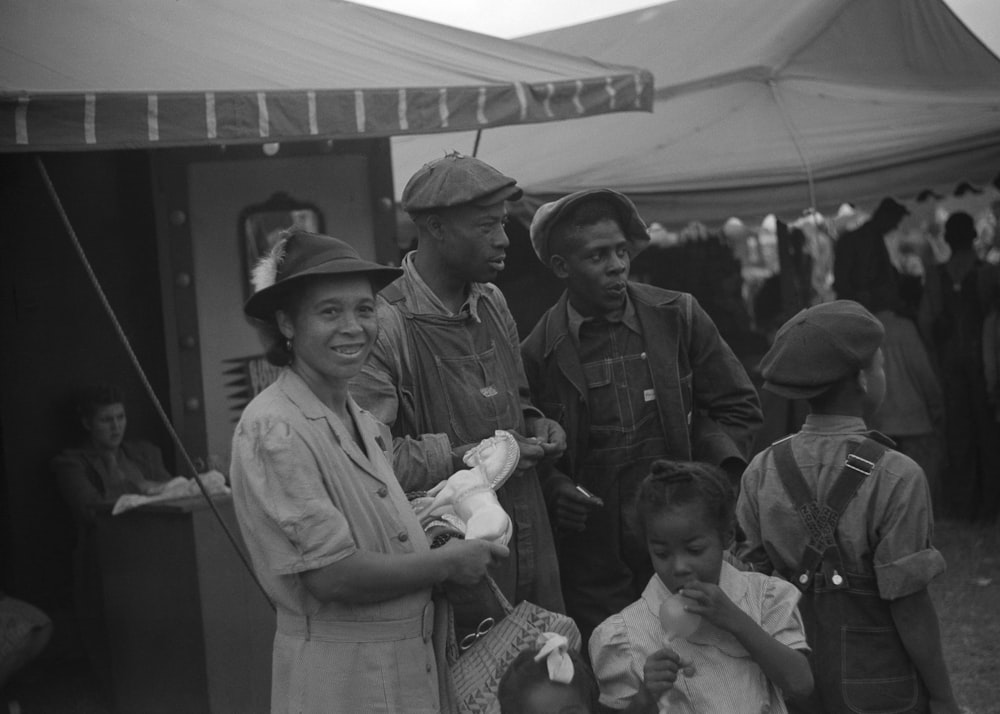 a group of people standing next to each other