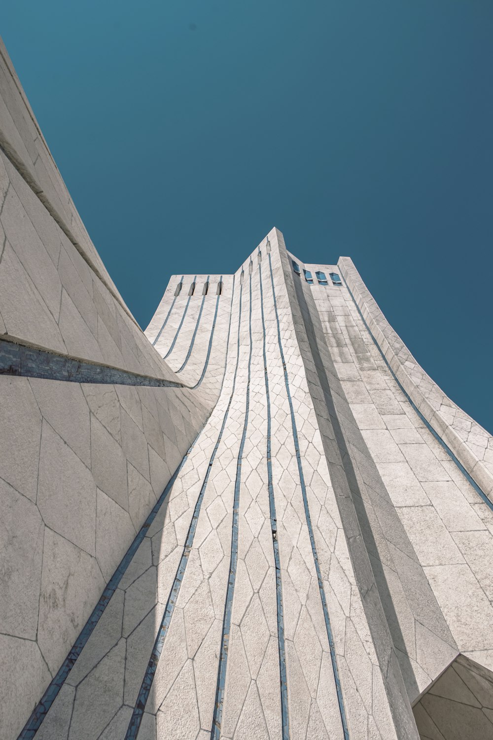 looking up at the top of a tall building