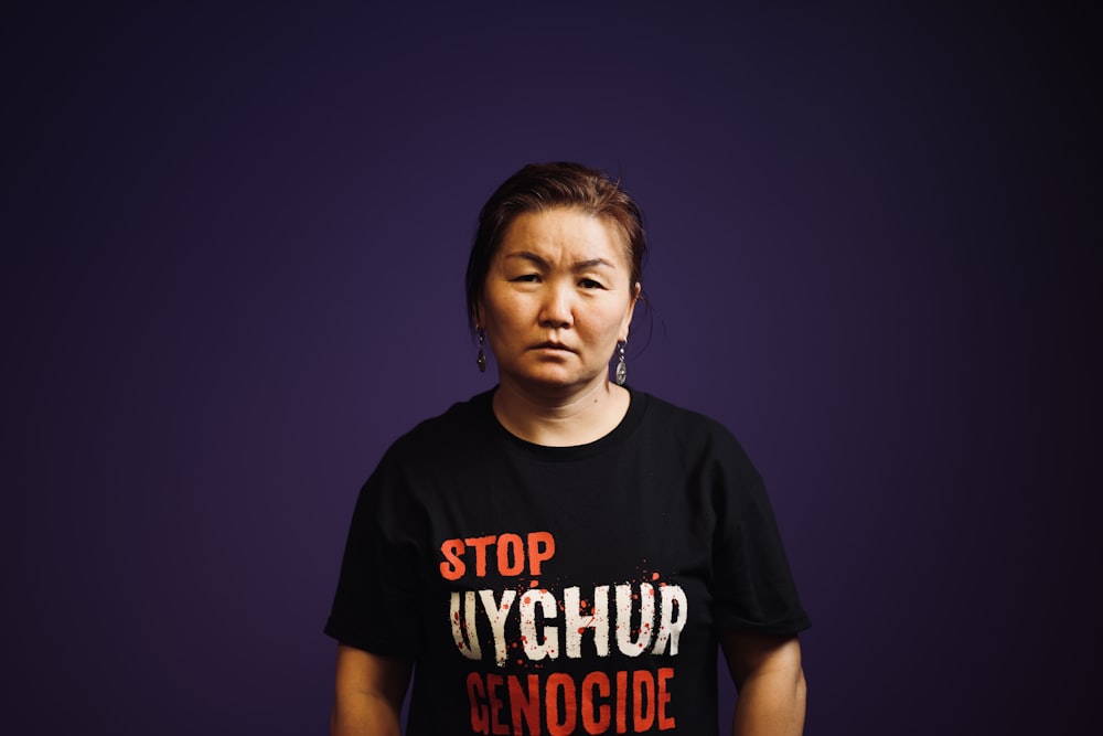 a woman in a black t - shirt with the words stop glychup
