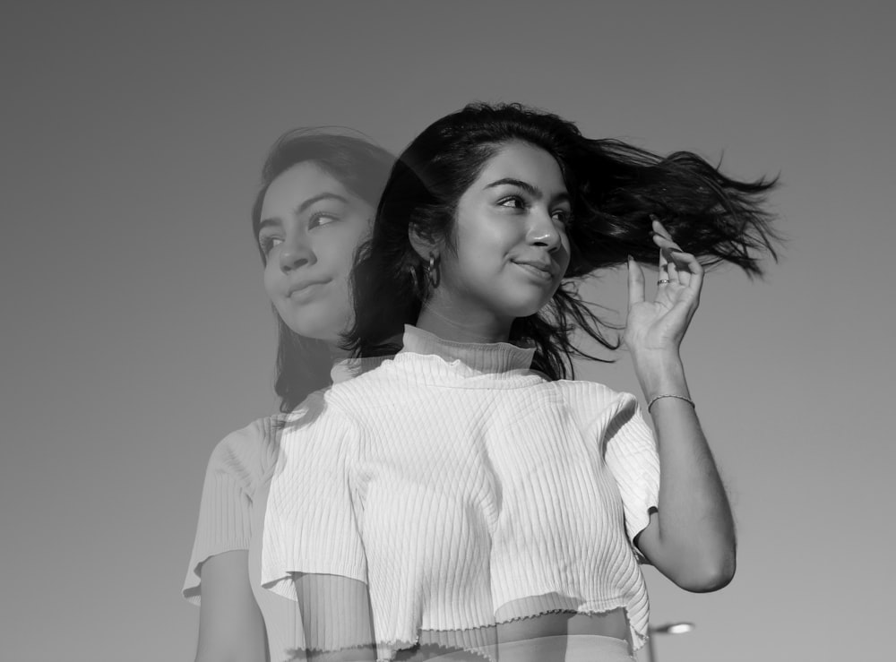 a black and white photo of two women