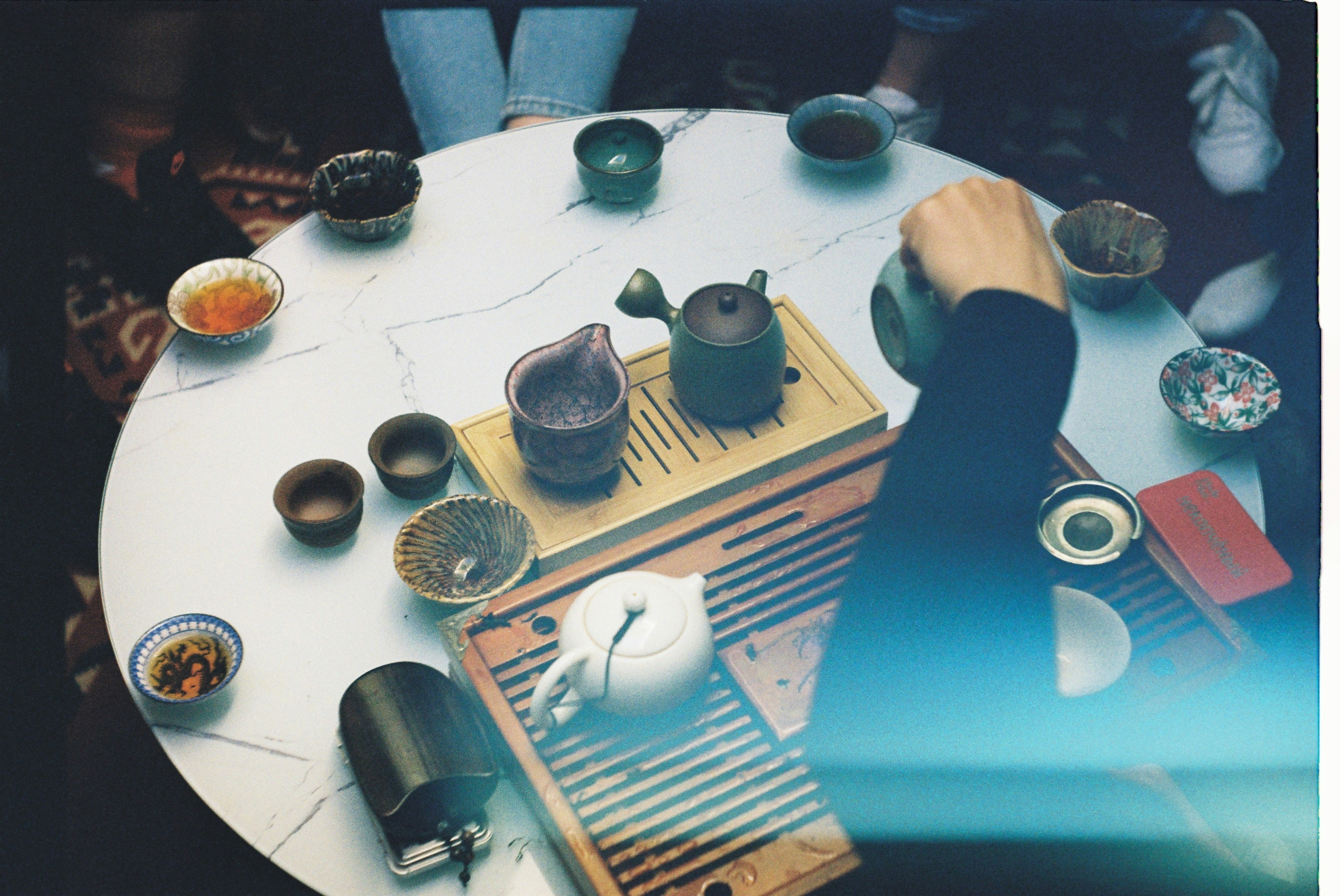 a white table topped with lots of cups and saucers
