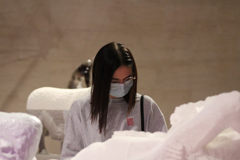 a woman wearing a face mask in a store