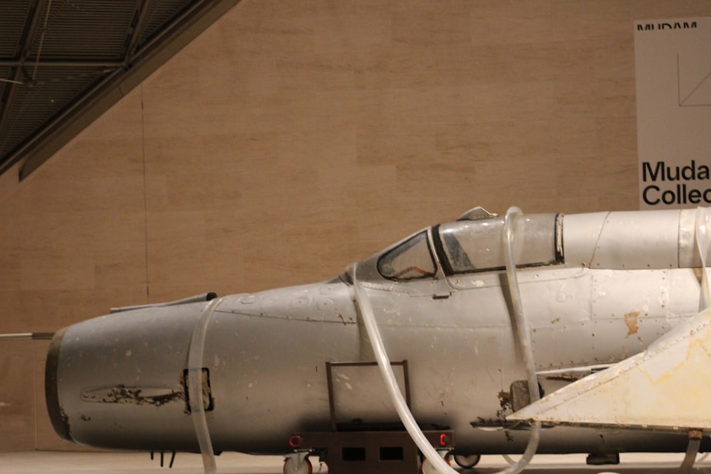 a fighter jet sitting on display in a museum