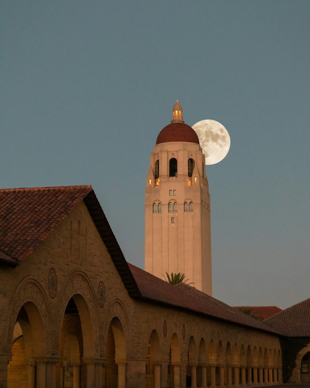 a large clock tower towering over a building