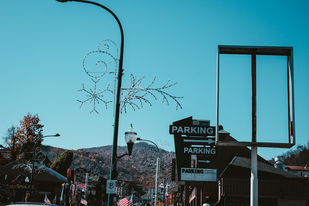 a parking sign on the side of a road