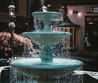 a water fountain in front of a building