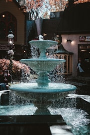 a water fountain in front of a building