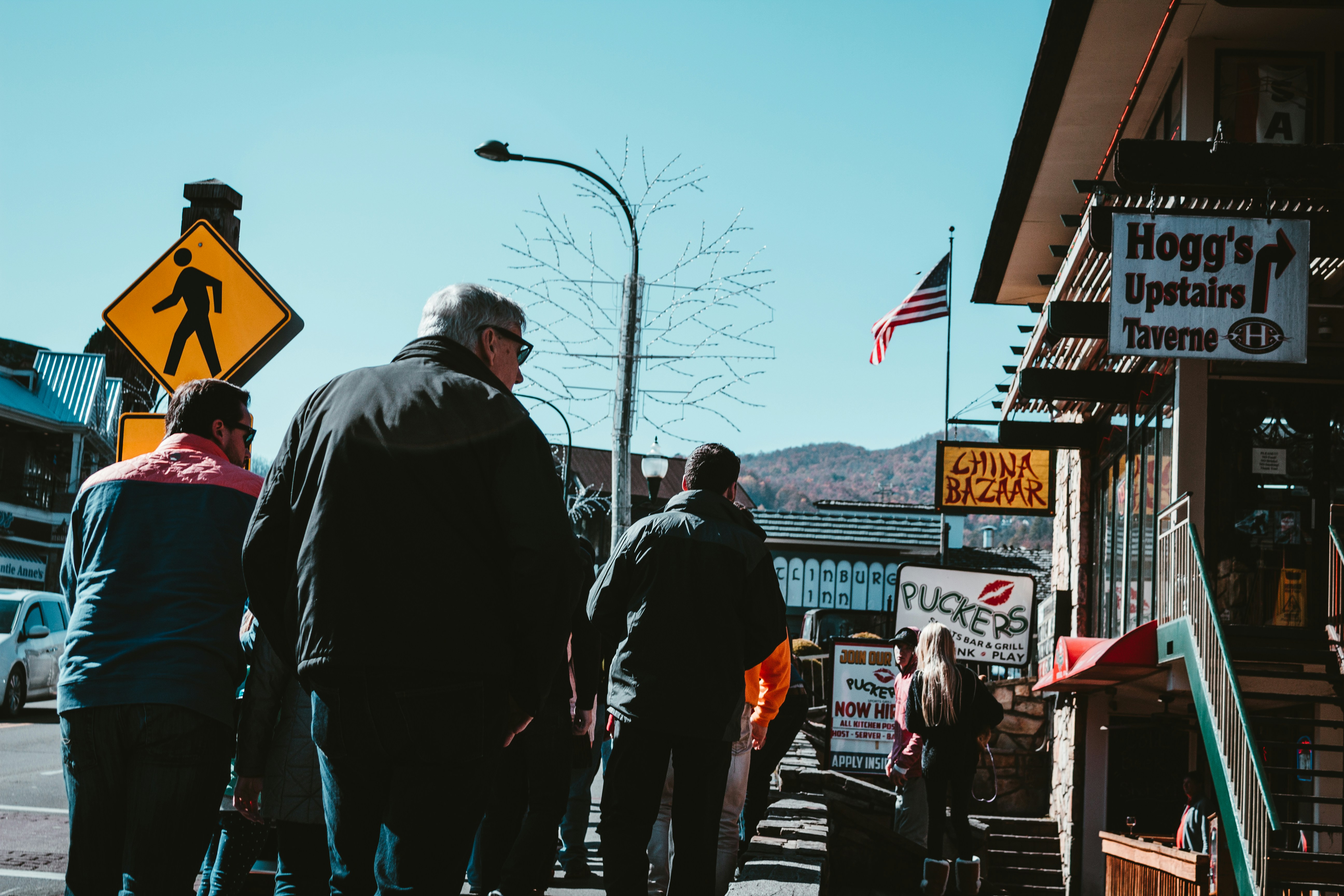 a group of people walking down a street