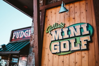 a sign for a golf club on the side of a building