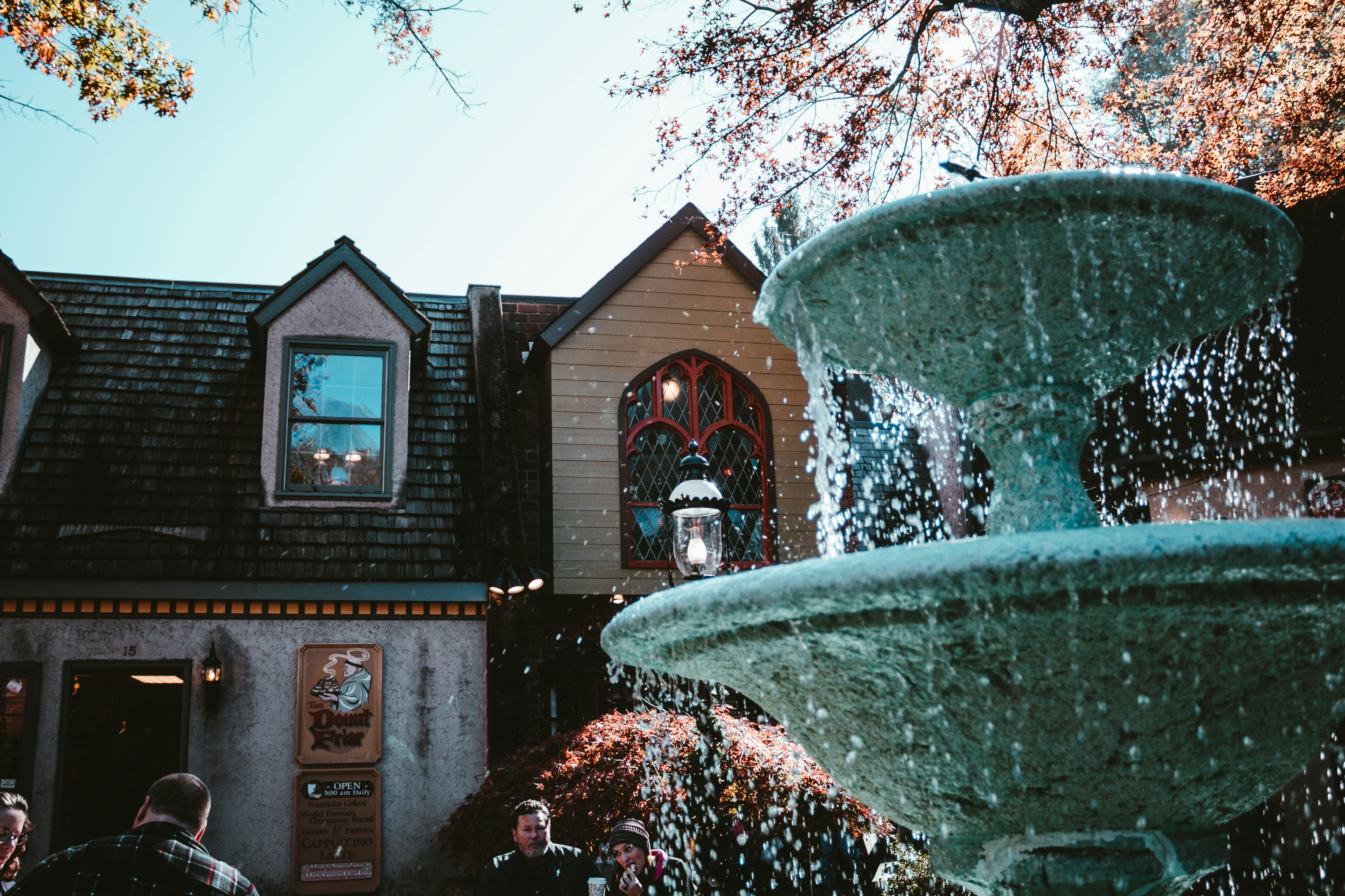 a water fountain in front of a house