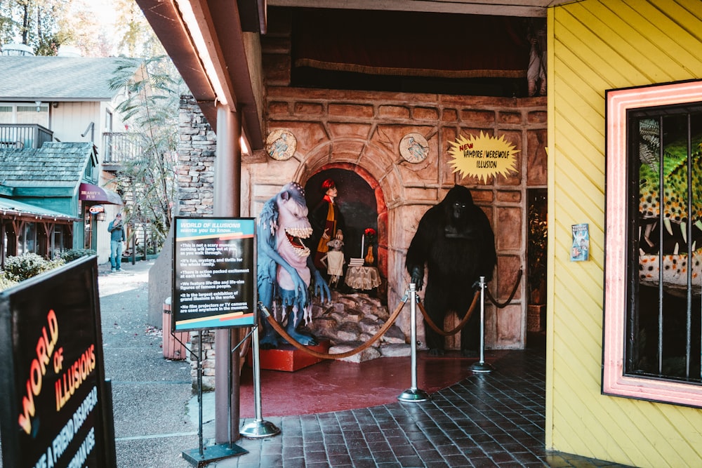 the entrance to a museum with a fake cow