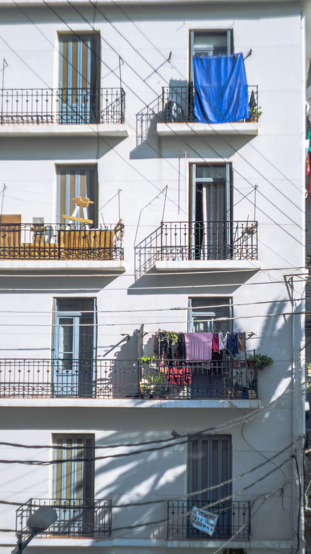 an apartment building with balconies and balconies on the balconies